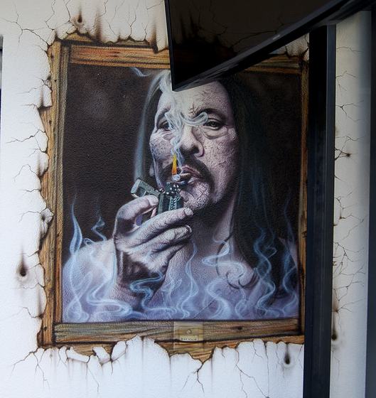 Portrait mit Zigarre im gemalten Rahmen
